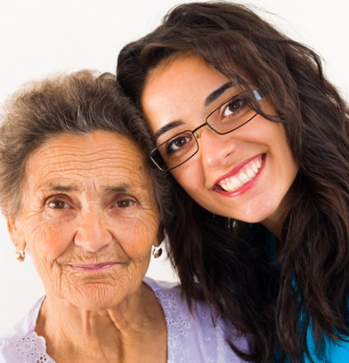caregiver and senior woman smiling