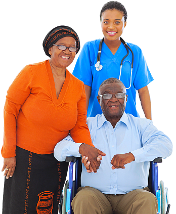 senior couple smiling with their caregiver