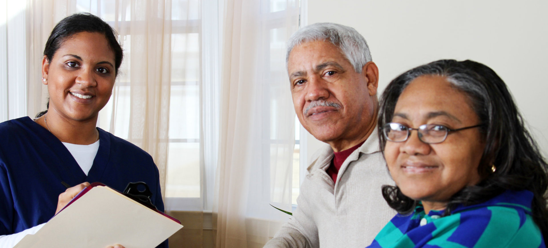 Home health care worker and an elderly couple